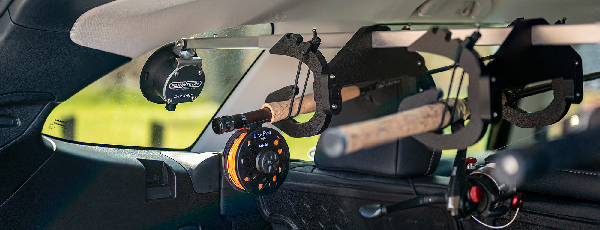 Fishing pole holder that uses car window to transport fishing poles